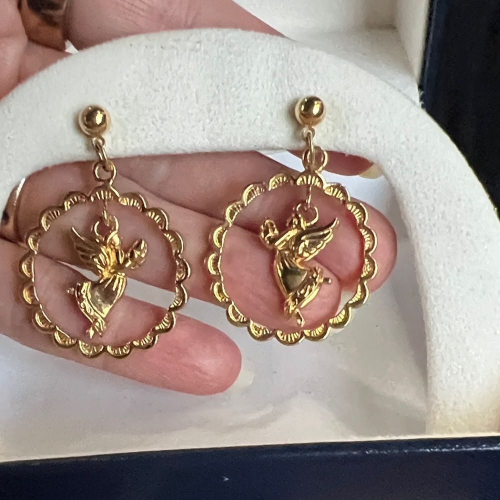 Avon Soaring Angel pierced earrings.